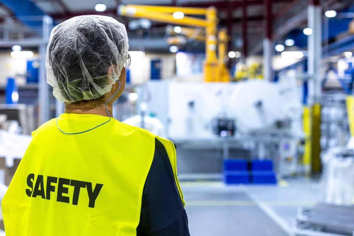 Portrait of safety worker in an industrial factory concet of safety and environment