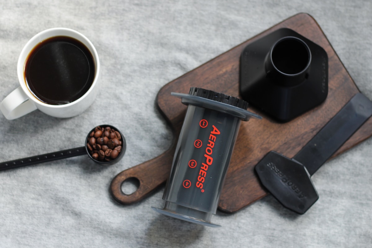 a cup of coffee and a spoon on a table