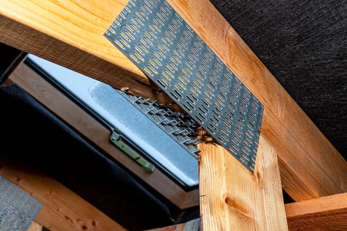 Barbed tile connecting the roof structure covered with a membrane on a single-family house view from the inside