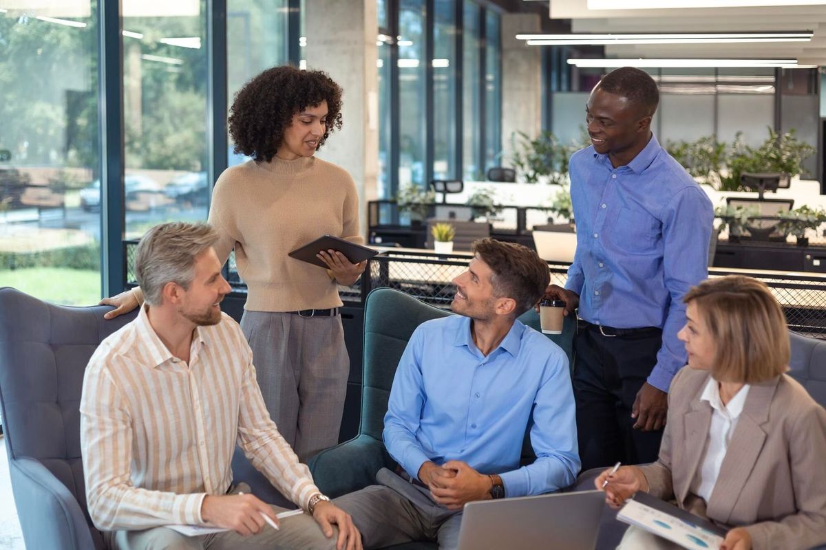 Group of happy progressive business people working on startup together at creative office