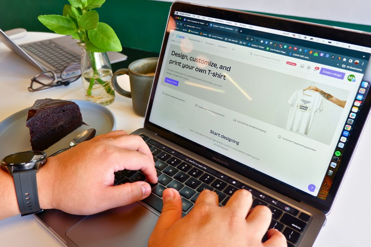 a person typing on a laptop at a table