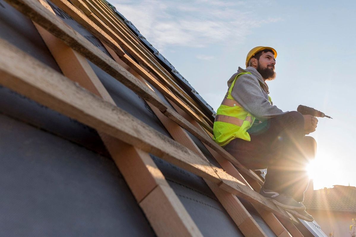 Man sitting on the roof in daylight