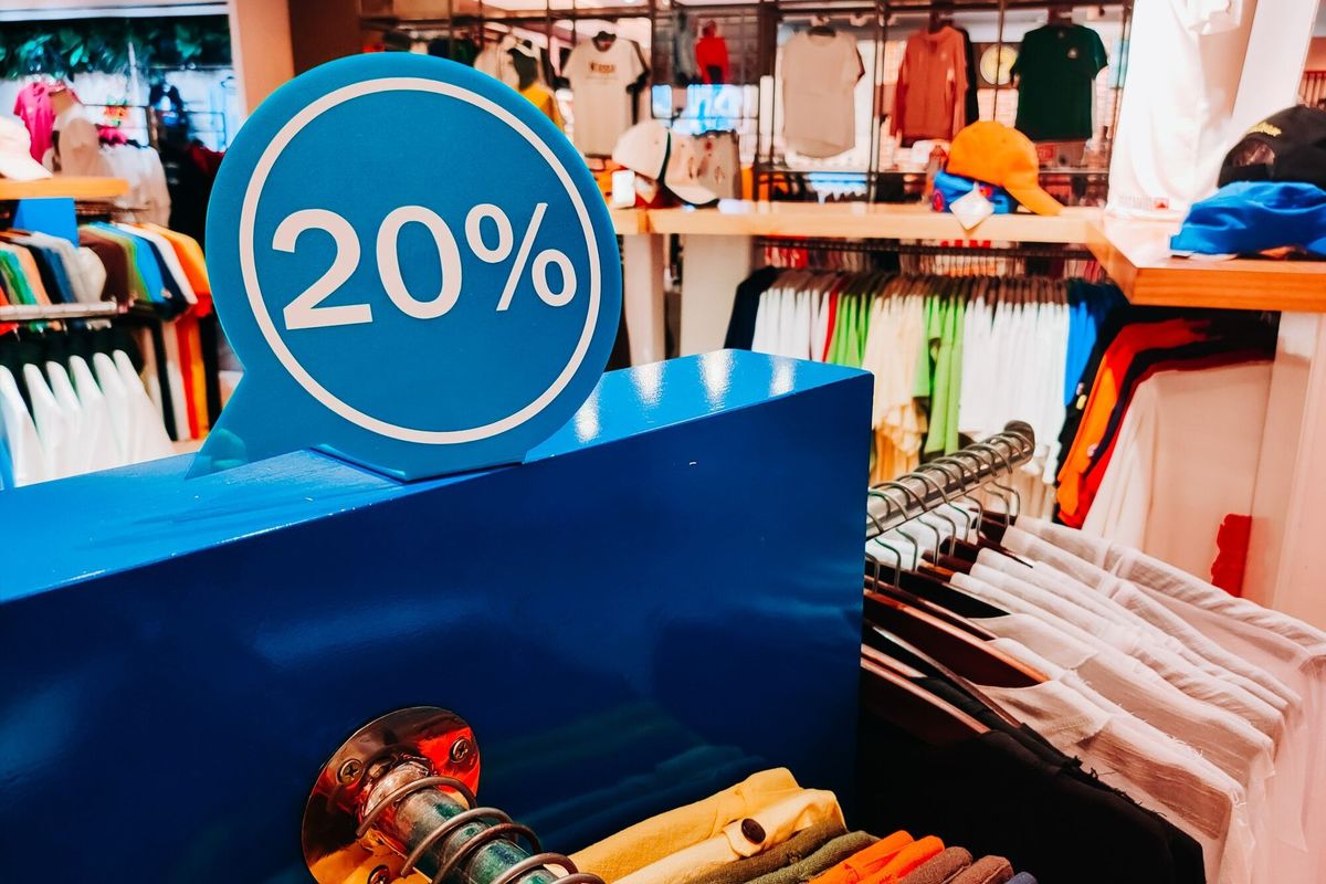 Shopping Sale T-shirts -50% discount. Sales in the male and female closing section (shirts). Horizontal copyspace