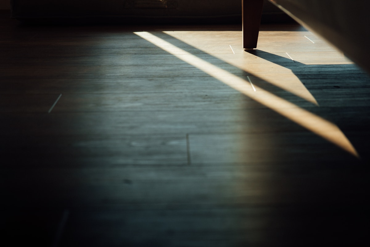 brown wooden bench on brown wooden floor