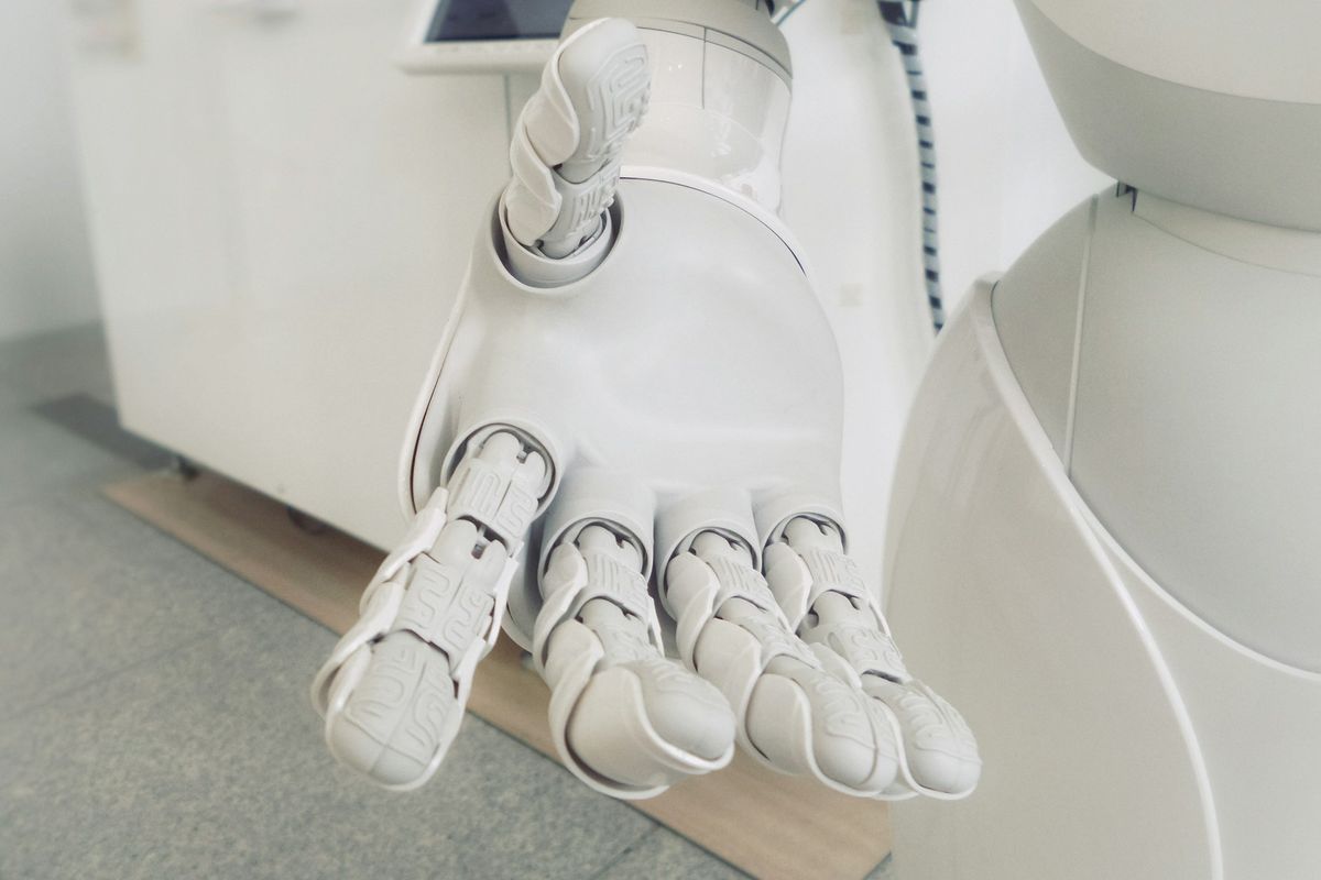 closeup photo of white robot arm