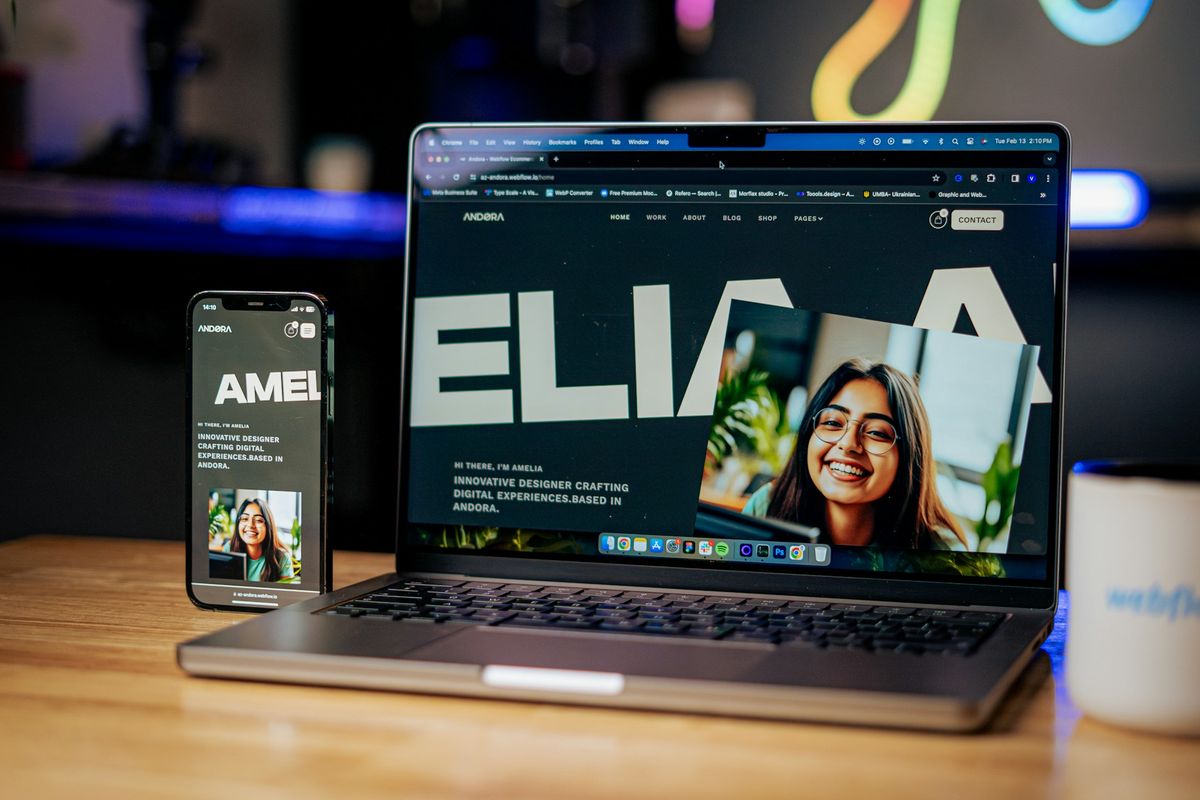 a laptop computer sitting on top of a wooden table
