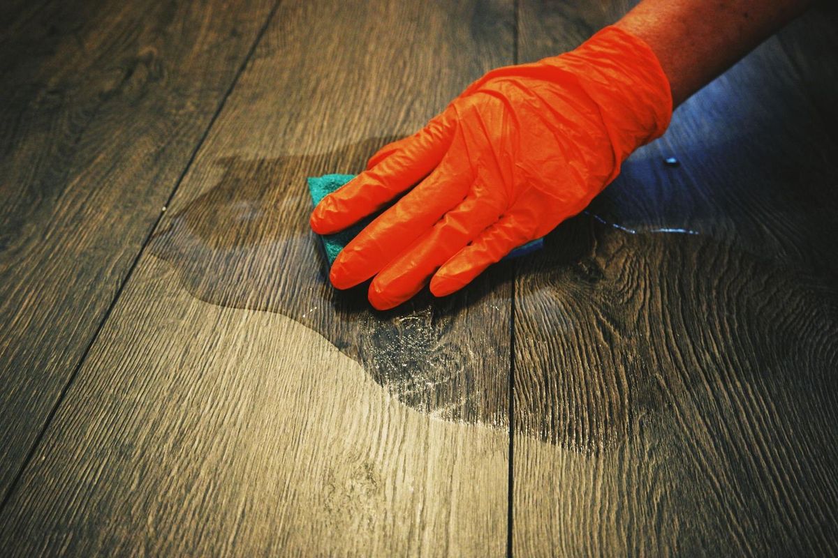 Close-up of person hand on wooden table