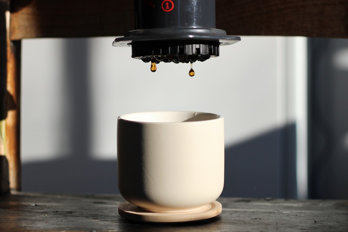 a coffee cup sitting on top of a wooden table