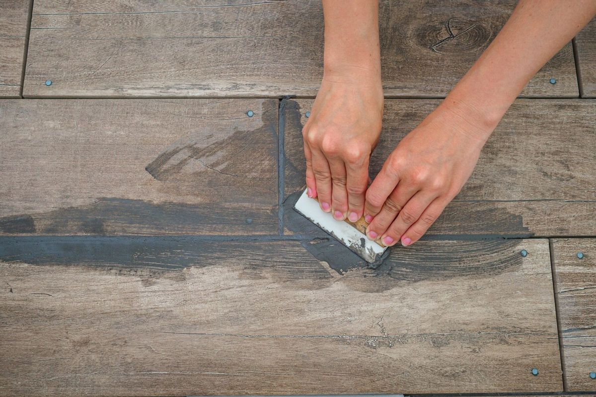 Grouting between ceramic tiles