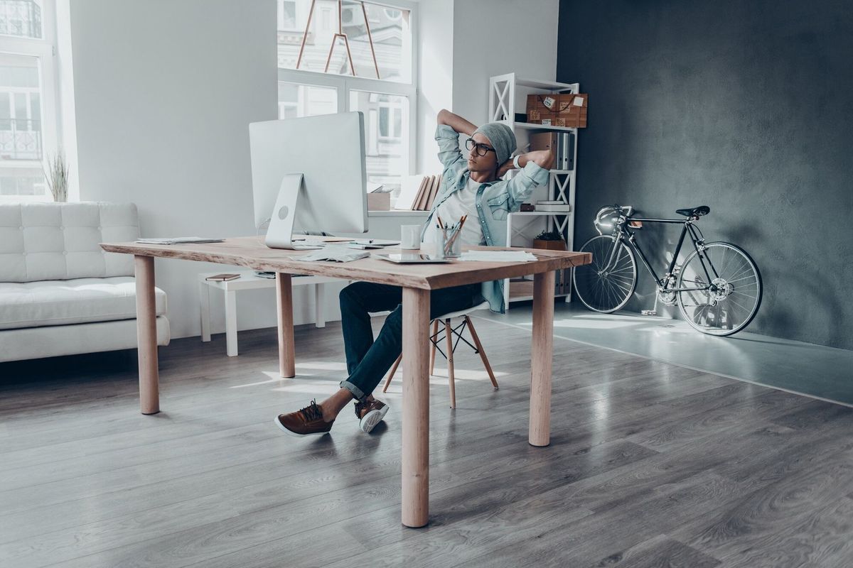 considering the next step. handsome young man looking at computer monitor 