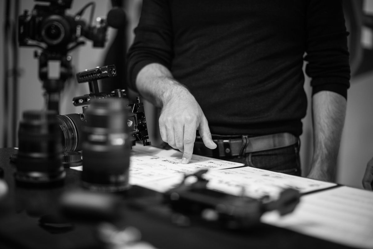 grayscale photo of person playing chess