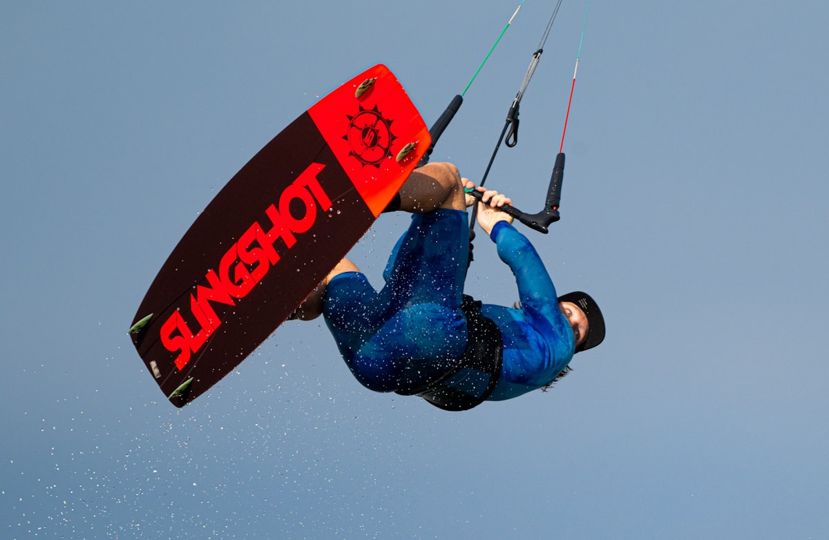 A man on a surfboard in the air