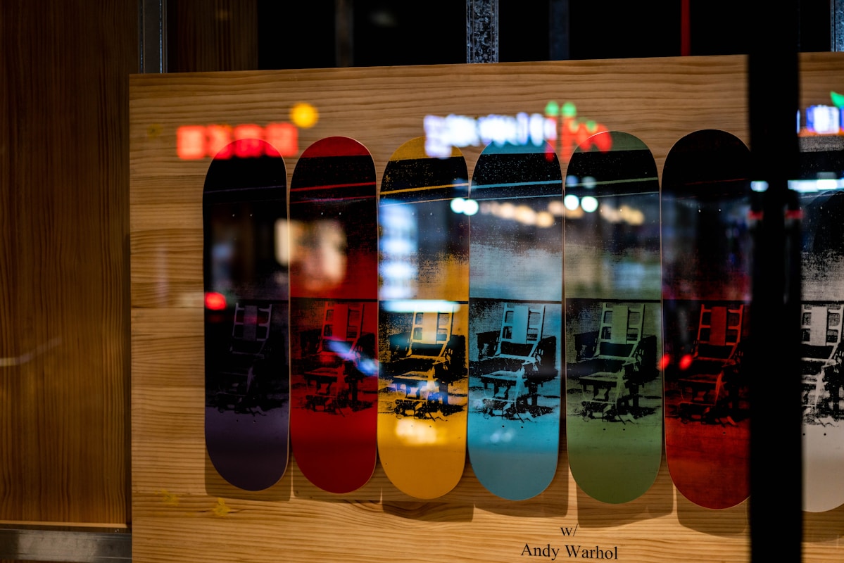 a group of skateboards sitting on top of a wooden wall